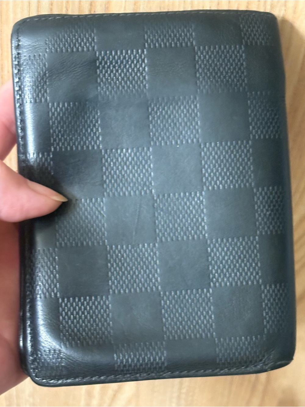 Authentic Louis Vuitton black Damier Infini leather bifold wallet